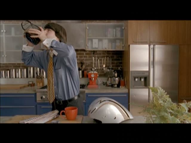 Demetri Martin chugging a carafe of coffee